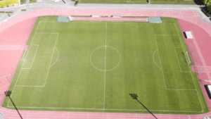 Grass football stadium in high-altitude at the mountains of Greece
